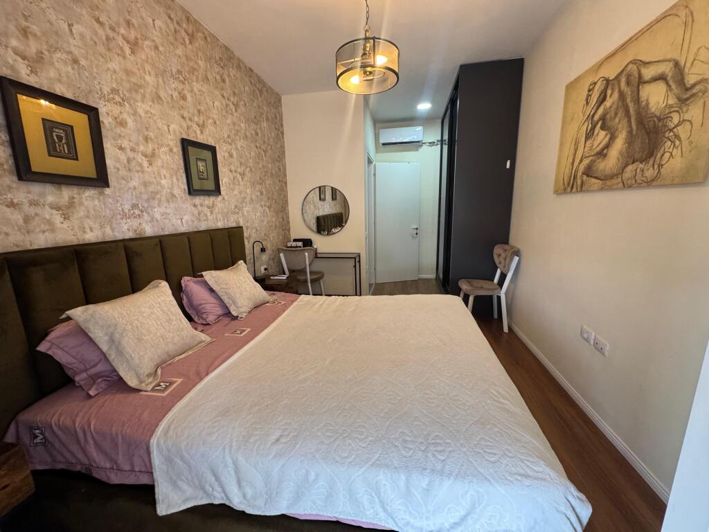I am selling a 1+1 apartment with parking space on Kavaja Street.