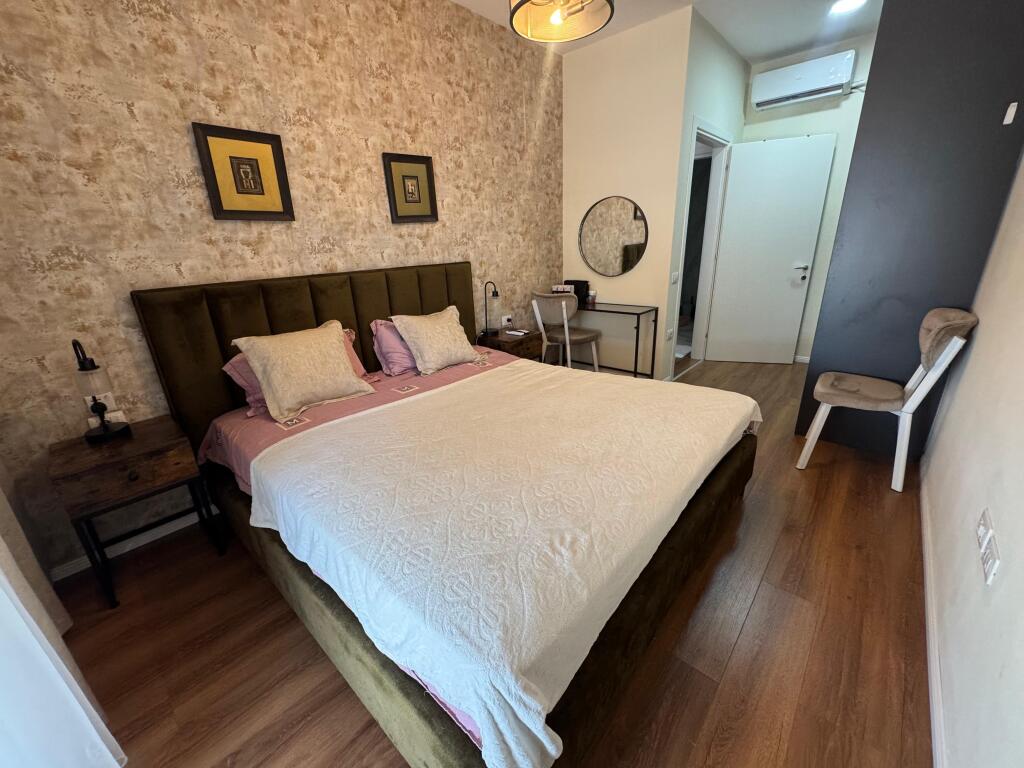 I am selling a 1+1 apartment with parking space on Kavaja Street.