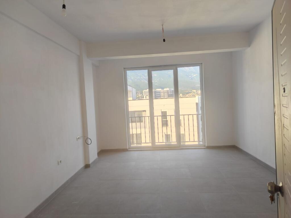At the end of 5 Maji Street, near the Reconstruction Apartments, a 2+1 apartment is for rent, unfurnished.