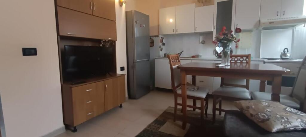 An apartment 2+1 is for rent near the center in Tirana.