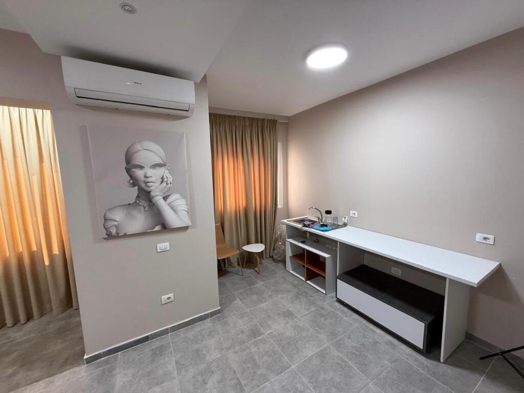 For sale 2+1 apartment currently converted into a business in a new building at the intersection of Oxhaku.