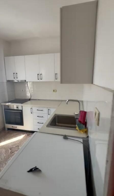 Empty apartment available in the building with arrow