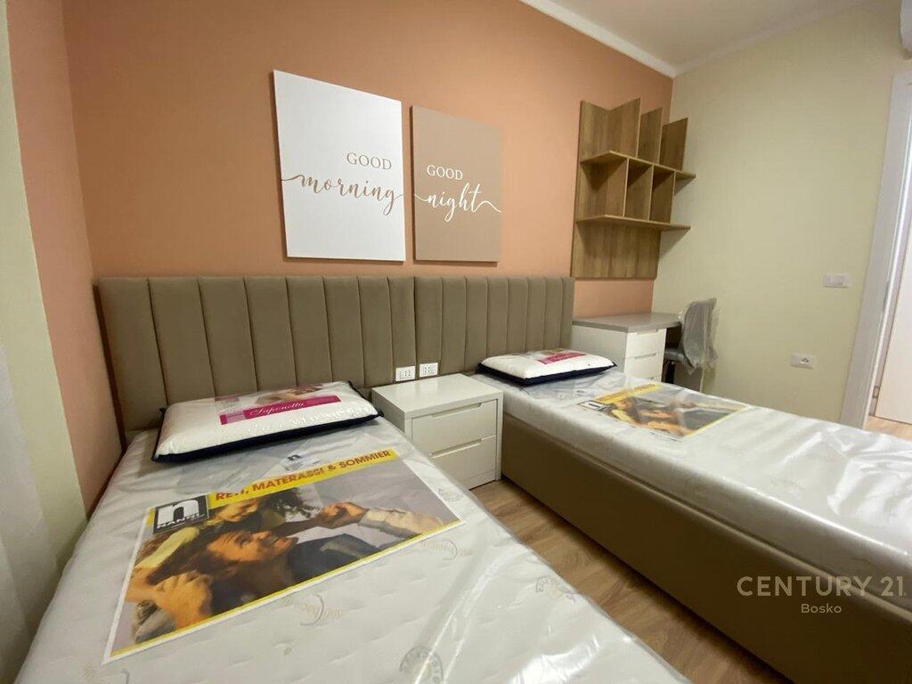 🏢 For Rent: 2+1+2 Apartment near Former Train Station – Beginning of New Boulevard (Blv. i Ri)  📍 Strategic location in one of Tirana’s most connected areas, with immediate access to main roads and just steps from the New Boulevard.  📐 Total area: 94 m² 🏢 Floor: 4th in a new 8-story building with elevator 🛋 Modern furnishing – exactly as shown in photos!  🛏 Apartment Layout: ▪ Living area + open kitchen ▪ 2 bedrooms ▪ 2 bathrooms (one with natural ventilation) ▪ 1 balcony ▪ Central hallway  🚗 Dedicated parking space – available for an additional 5,000 ALL/month  🔒 Quiet, safe, and family-friendly environment 🐾 Pets are not allowed ✅ Families preferred 📦 Available immediately  📞 For more information or to schedule a viewing, contact us at: 📲 0685000221