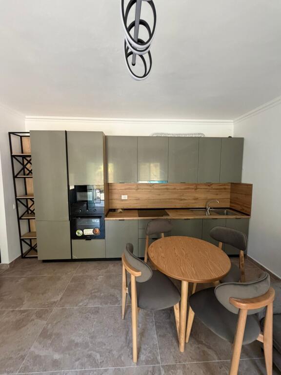 Apartment for sale in the Shkëmbi i Kavajës area, type 1+1 with veranda and storage room.