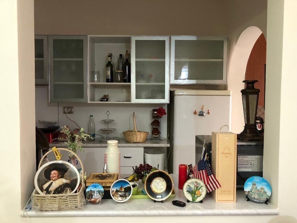 DUPLEX FOR SALE – MUHAMET GJOLLESHA STREET (21 DECEMBER)  📍 Behind the “Sabaudin Gabrani” school 📐 235 m² | 2 mortgages 🏢 5th &amp; 6th floor | Existing building ☀️ East–West orientation  Layout: 2 living rooms, 2 kitchens, 3 bedrooms, 4 balconies (1 closed 10 m²) + large veranda.  ✔️ Renovated ✔️ Parquet &amp; wooden stairs ✔️ Fireplace, solar panel ✔️ Security cameras  💰 400,000 € (For sale due to emigration)