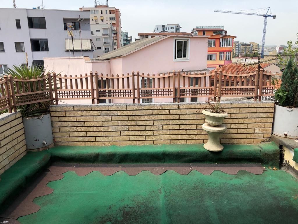 DUPLEX FOR SALE – MUHAMET GJOLLESHA STREET (21 DECEMBER)  📍 Behind the “Sabaudin Gabrani” school 📐 235 m² | 2 mortgages 🏢 5th &amp; 6th floor | Existing building ☀️ East–West orientation  Layout: 2 living rooms, 2 kitchens, 3 bedrooms, 4 balconies (1 closed 10 m²) + large veranda.  ✔️ Renovated ✔️ Parquet &amp; wooden stairs ✔️ Fireplace, solar panel ✔️ Security cameras  💰 400,000 € (For sale due to emigration)