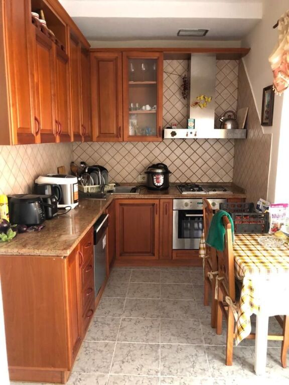 DUPLEX FOR SALE – MUHAMET GJOLLESHA STREET (21 DECEMBER)  📍 Behind the “Sabaudin Gabrani” school 📐 235 m² | 2 mortgages 🏢 5th &amp; 6th floor | Existing building ☀️ East–West orientation  Layout: 2 living rooms, 2 kitchens, 3 bedrooms, 4 balconies (1 closed 10 m²) + large veranda.  ✔️ Renovated ✔️ Parquet &amp; wooden stairs ✔️ Fireplace, solar panel ✔️ Security cameras  💰 400,000 € (For sale due to emigration)