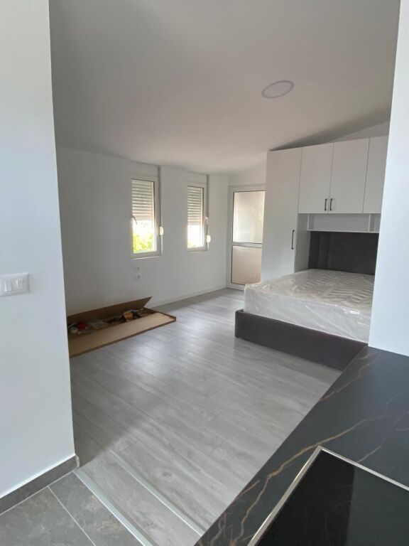 STUDIO APARTMENT 27000 LEKE.FORMER ELECTRIC MARKET.BUILDING WITH ANTENNAS