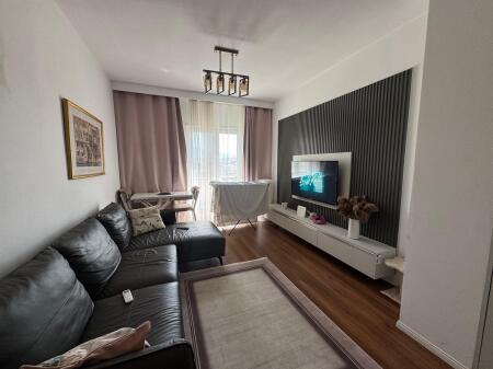 I am selling a 1+1 apartment with parking space on Kavaja Street.