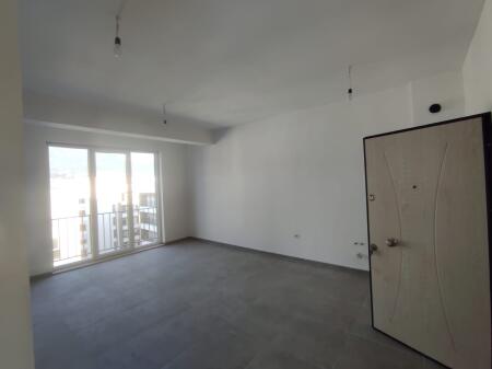 At the end of 5 Maji Street, near the Reconstruction Apartments, a 2+1 apartment is for rent, unfurnished.