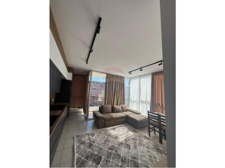 An apartment 1+1 is offered for rent on Bulevardi i Ri.
