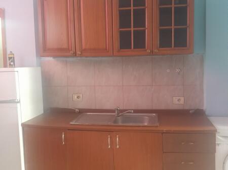 In front of the building with arrows  